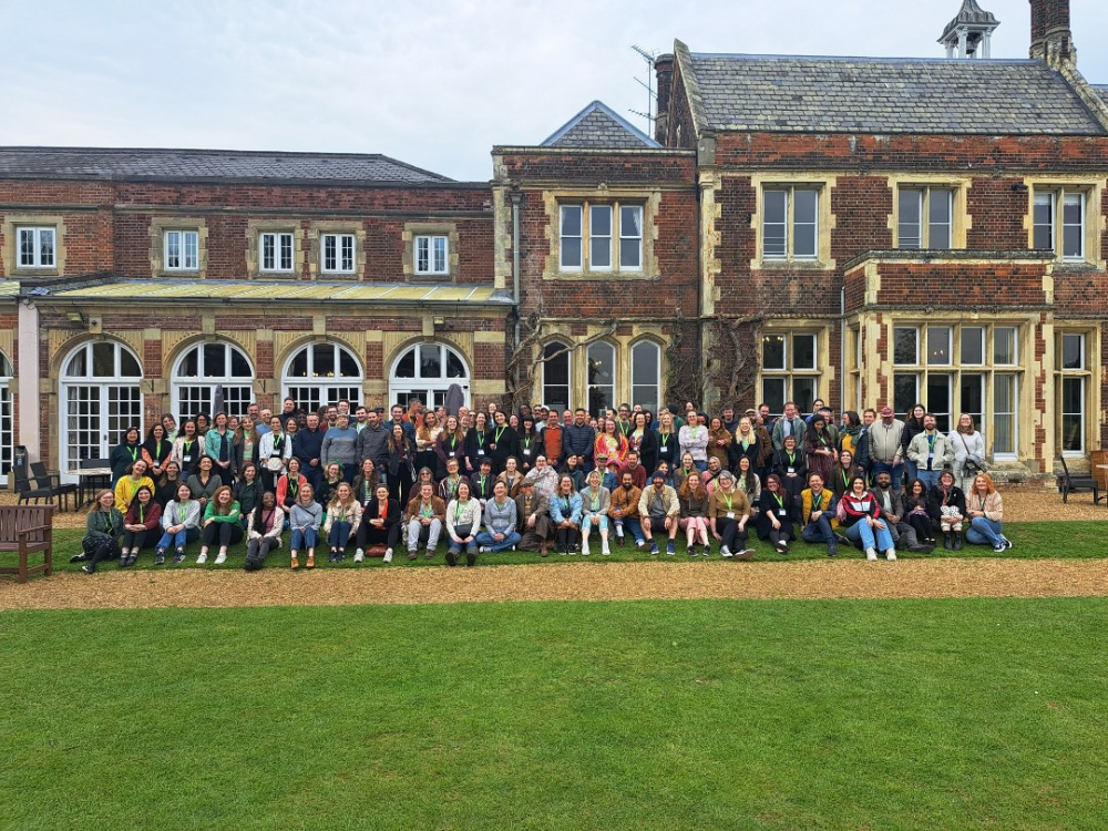 A large group of people smiling for a photo