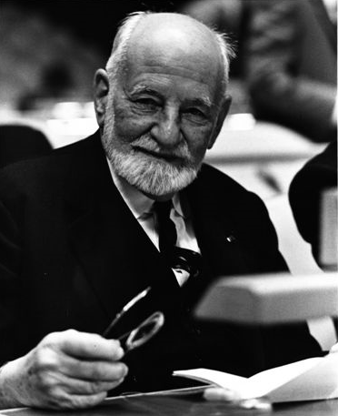 A black and white portrait of an older man
